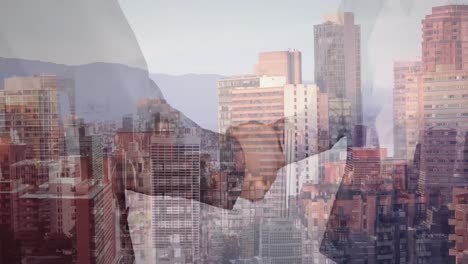 Mid-section-of-businessman-and-businesswoman-shaking-hands-against-aerial-view-of-cityscape