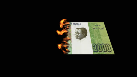 burning angolan kwanza banknote