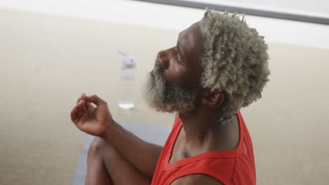 Video-of-african-american-senior-man-meditating