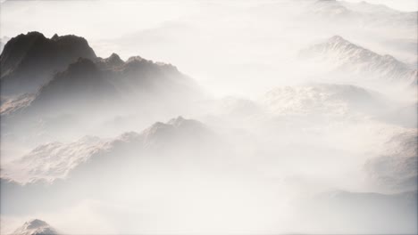 distant mountain range and thin layer of fog on the valleys