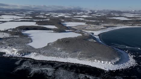 aerial view of hokkaido coastline in japan with snow in winter