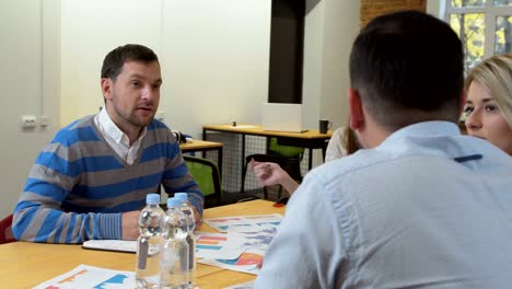 business team meeting involved diverse people participating in creative sustainable ideas steadicam shot across boardroom table shared work space