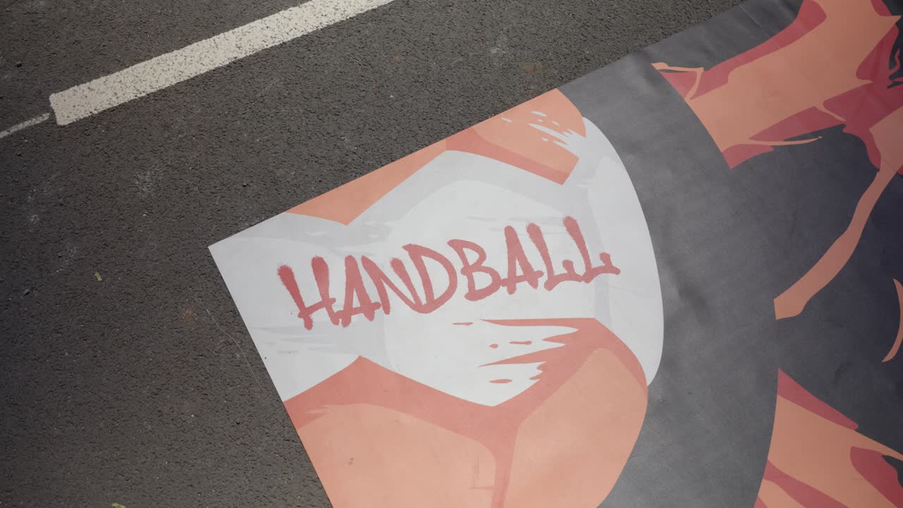 rotating shot of a handball mural on the floor at a sports event