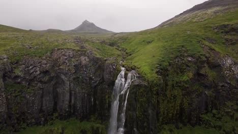 Aerial-Footage-of-Waterfall-During-Cloudy-Summer-In-Olafsvik,-Snaefellsness-Peninsula,-Iceland