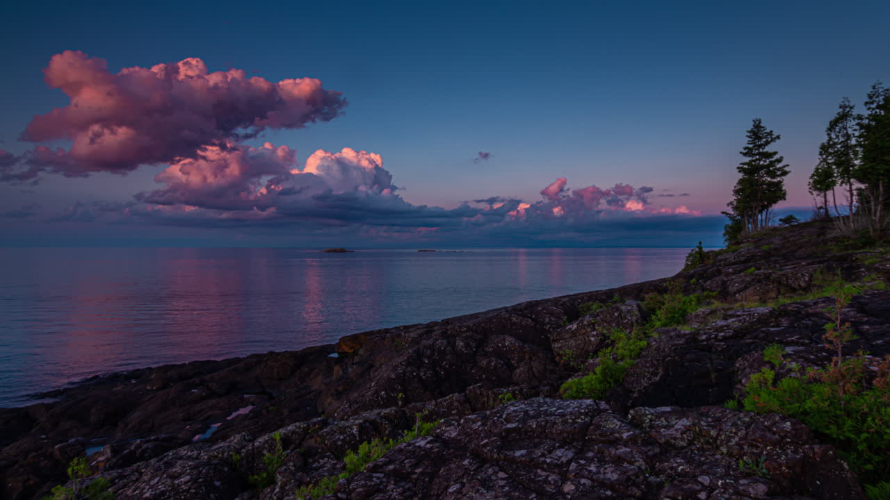 Time-lapse of sunset light catching clouds above Lake Superior, Michigan's Upper Peninsula 4K