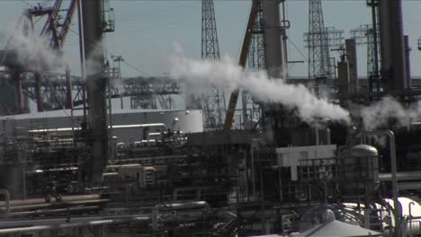 steam rises from an industrial area