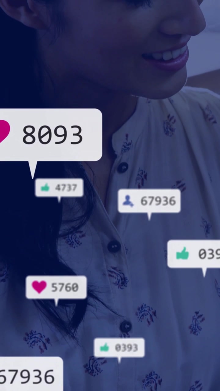 Vertical video: Woman turning and smiling as social hearts and likes popping up, showing growth
