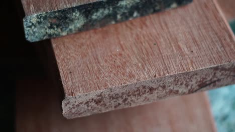 slow motion cinematic wood planks on a workbench