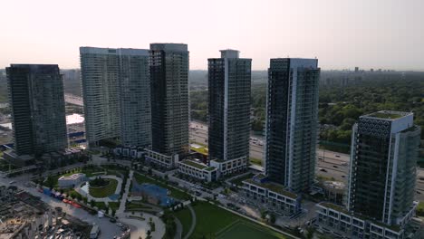 Condo-development-under-construction-in-large-urban-city-next-to-multi-lane-highway