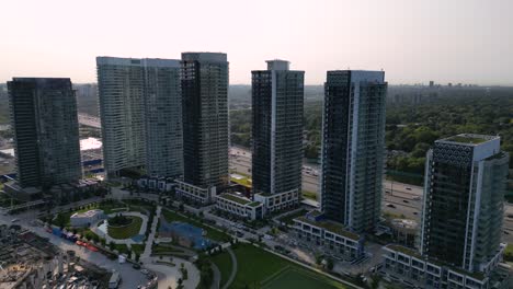 condo development under construction in large urban city next to multi-lane highway