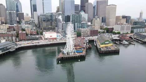 a drone fly by shot of the great ferris wheel in seattle downtown, washington, united states of america