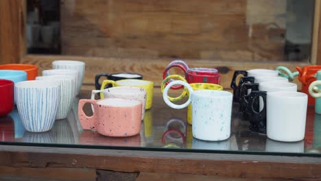 colorful ceramic cups displayed for sale