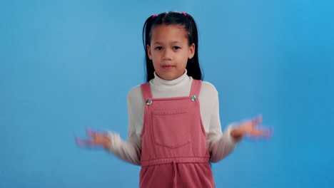 Portrait of a young girl shrugging