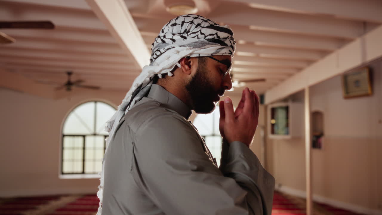 Muslim man praying in a mosque