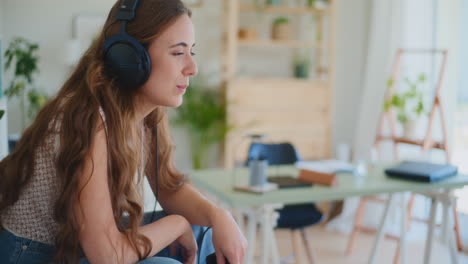 positive woman bouncing to music