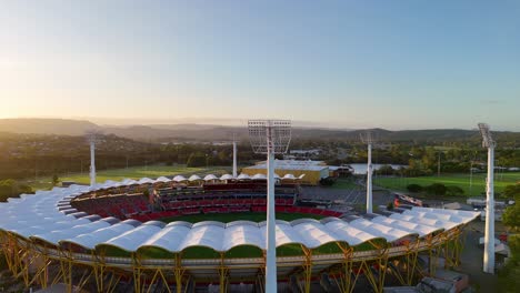 stadium surrounded by nature at sunset