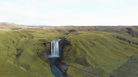 Skogafoss-waterfall-and-Skoga-river-in-green-highlands-of-Iceland