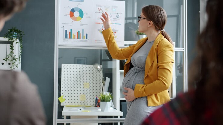 Pregnant Businesswoman Giving a Presentation