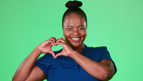 Black-woman-with-heart-hands-isolated-on-studio