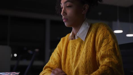 Tired-businesswoman-working-on-laptop-in-a-modern-office