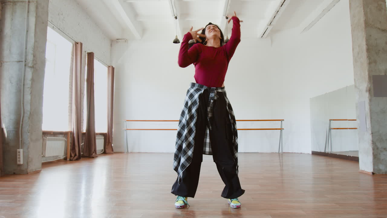 Young Woman Dancing Hip Hop in a Studio