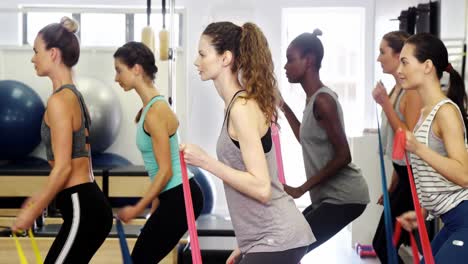 Beautiful-women-exercising-in-fitness-studio