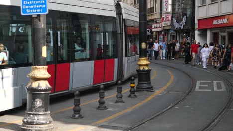 tram and pedestrian activity in a city street