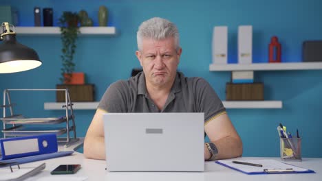 Home-office-worker-man-looking-nervously-at-camera.