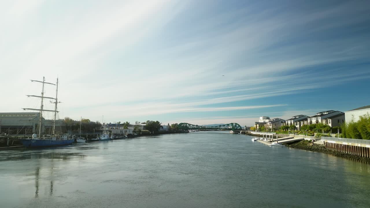 Aerial perspectives showcase the historic Park Street Bridge spanning the Tidal Canal, a key link between two vibrant areas.