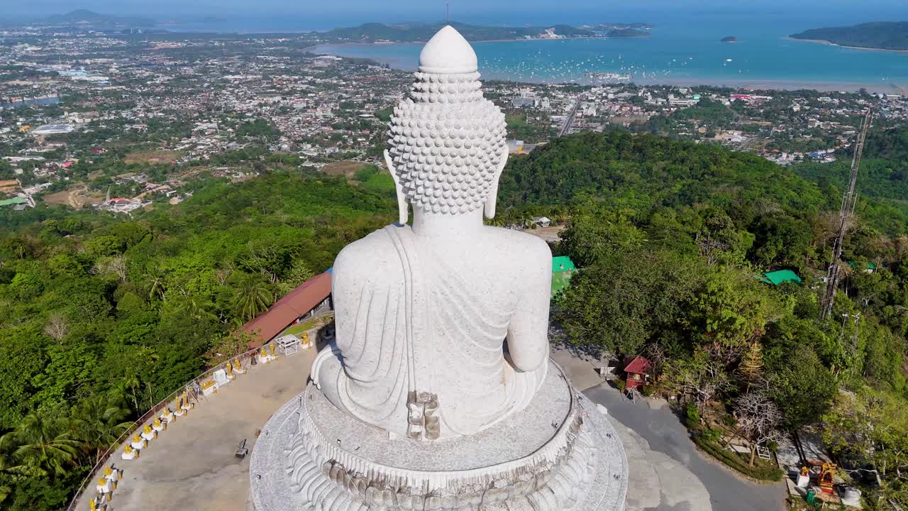 Aerial view of Big Buddha statue in Phuket overlooking lush landscape