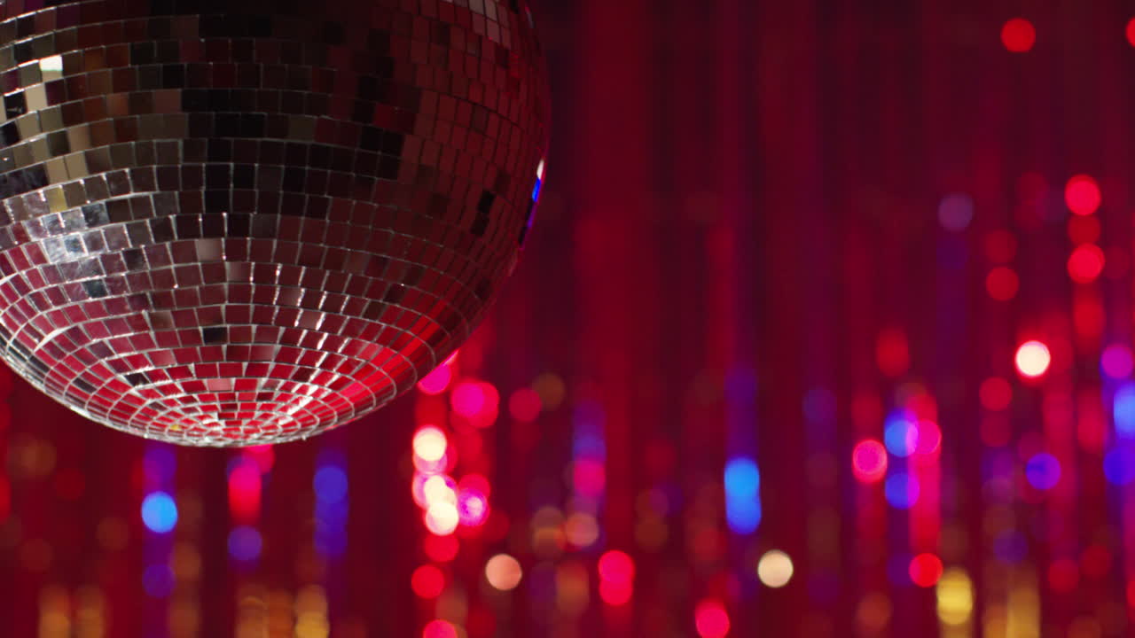 Close Up Of Revolving Mirrorball In Night Club Or Disco With Flashing Strobe Lighting And Sparkling Lights In Background 1