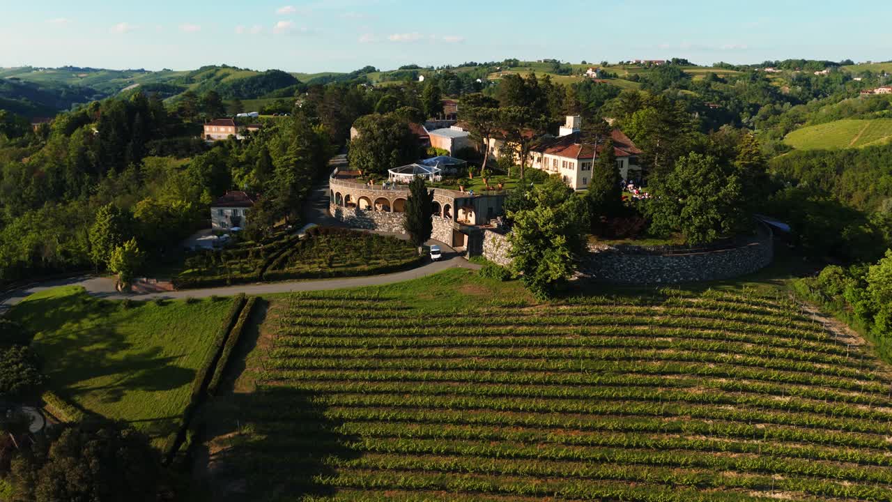 Surrounded by scenic vineyards, a charming wedding venue in Piedmont, Italy, under clear skies