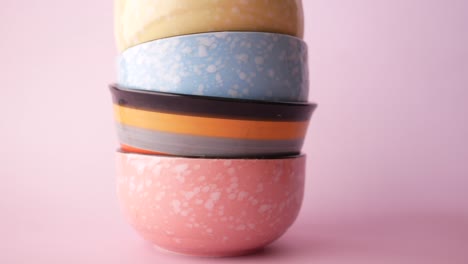 stack of colorful empty bowl on table