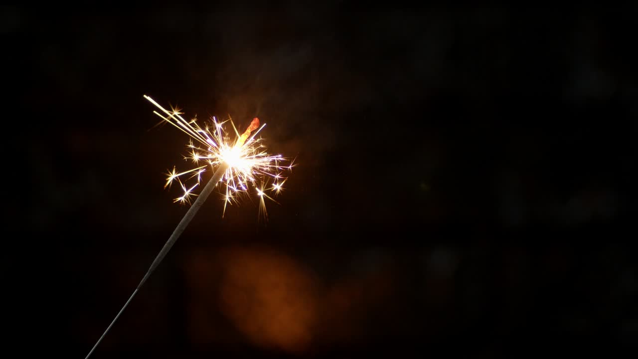 Christmas sparkler. On a black background.