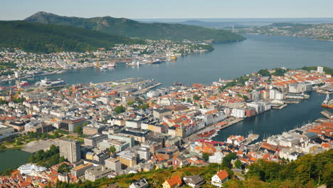 a view of the city of bergen below are the marinas and large cruise ships 4k video