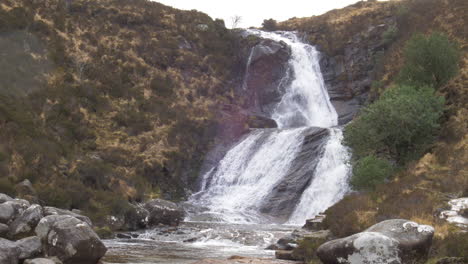 waterfall in scotland with a nice view on the landscape