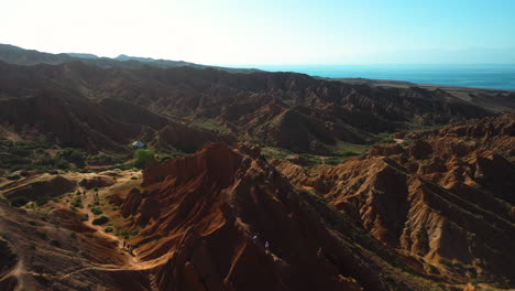 wide aerial shot of fairy tale canyon and issyk-kul lake in karakol, kyrgyzstan