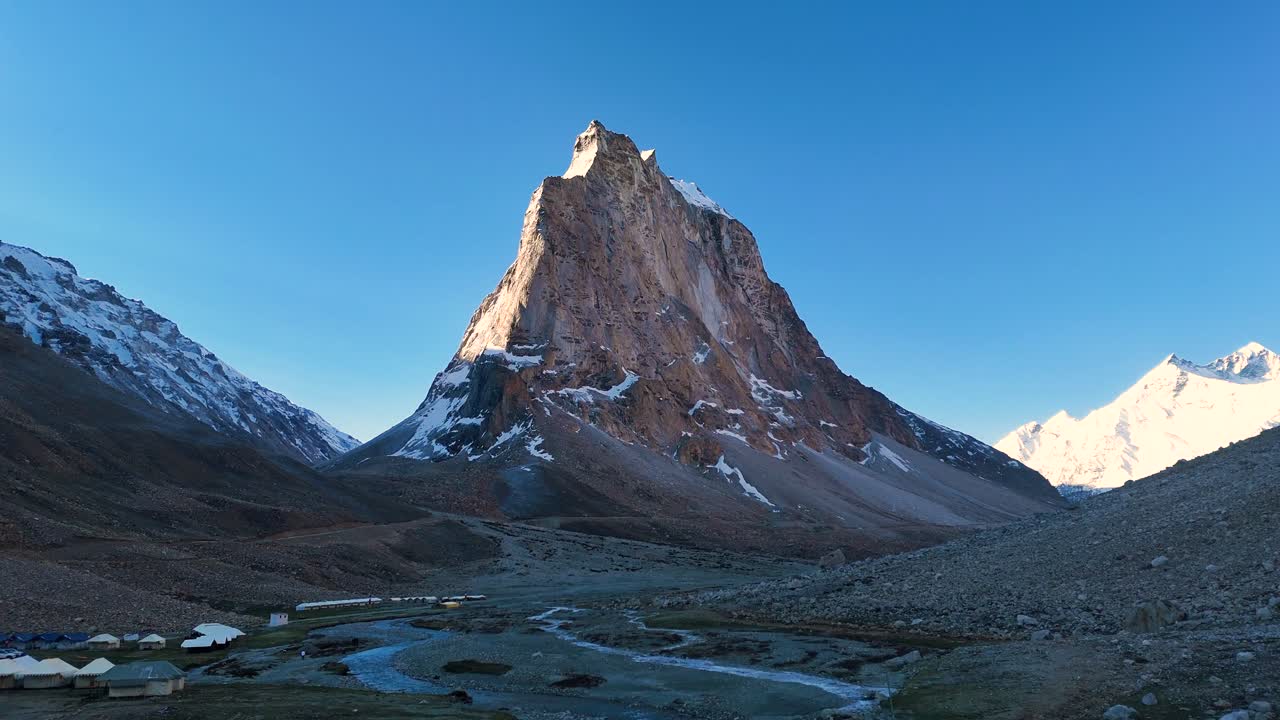 Aerial drone shot highlighting the crisp morning atmosphere over Gumbok Rangan at sunrise.