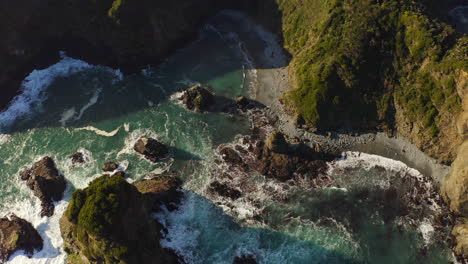 rocks and cliff form a beach area of north patagonia, chile, parga farm