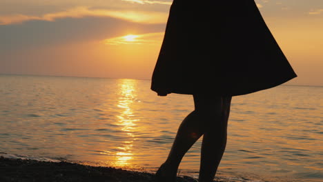 emotional woman rejoices on a summer day spinning in a dress