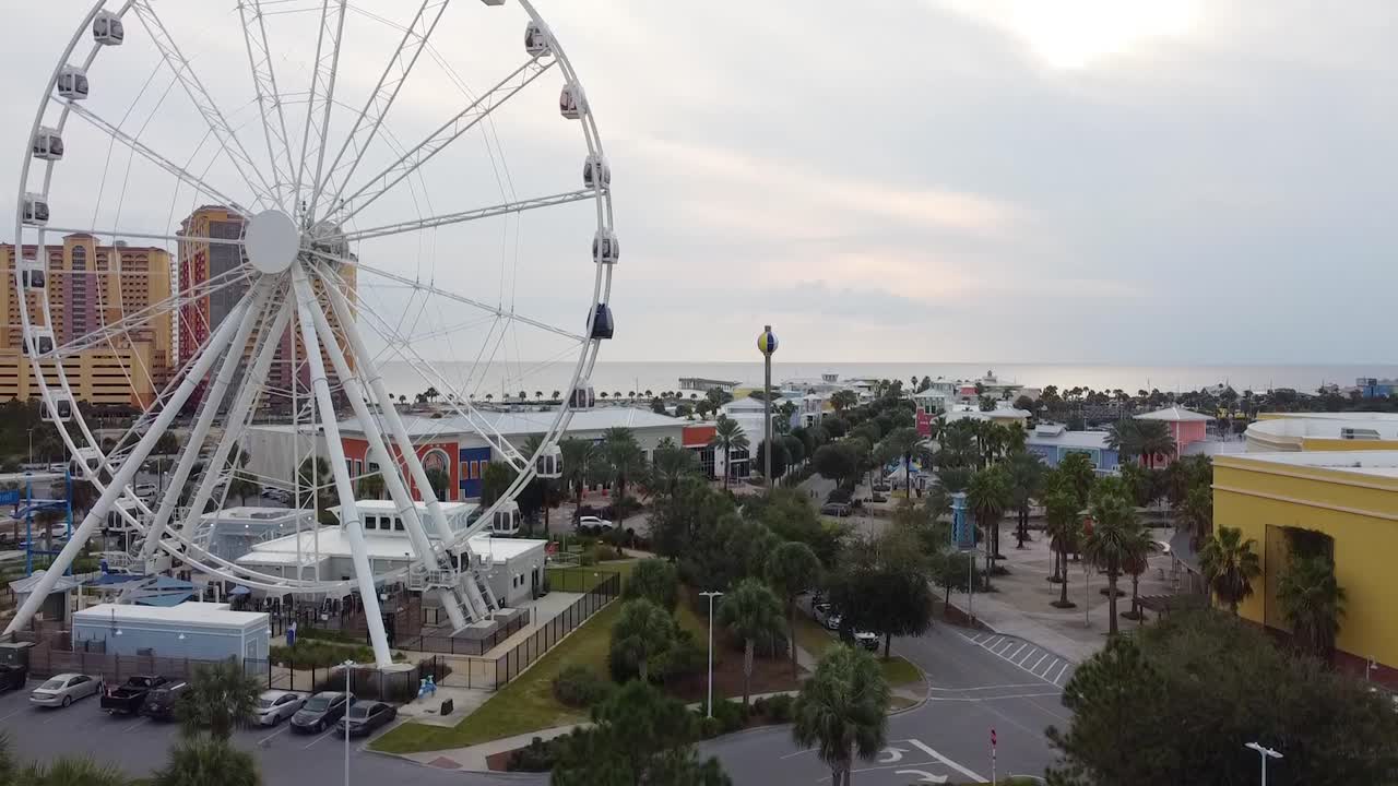 Aerial view of ferris wheel during beach sunset in Florida
