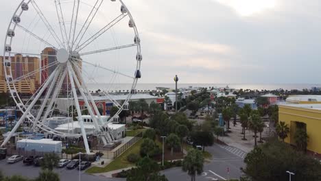 aerial view of ferris wheel during beach sunset in florida