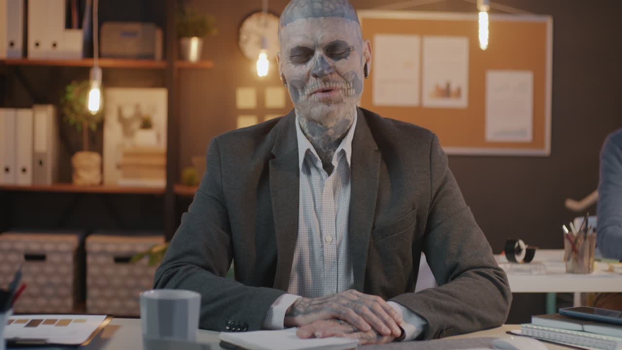 Businessman with Skull Face Paint in Office