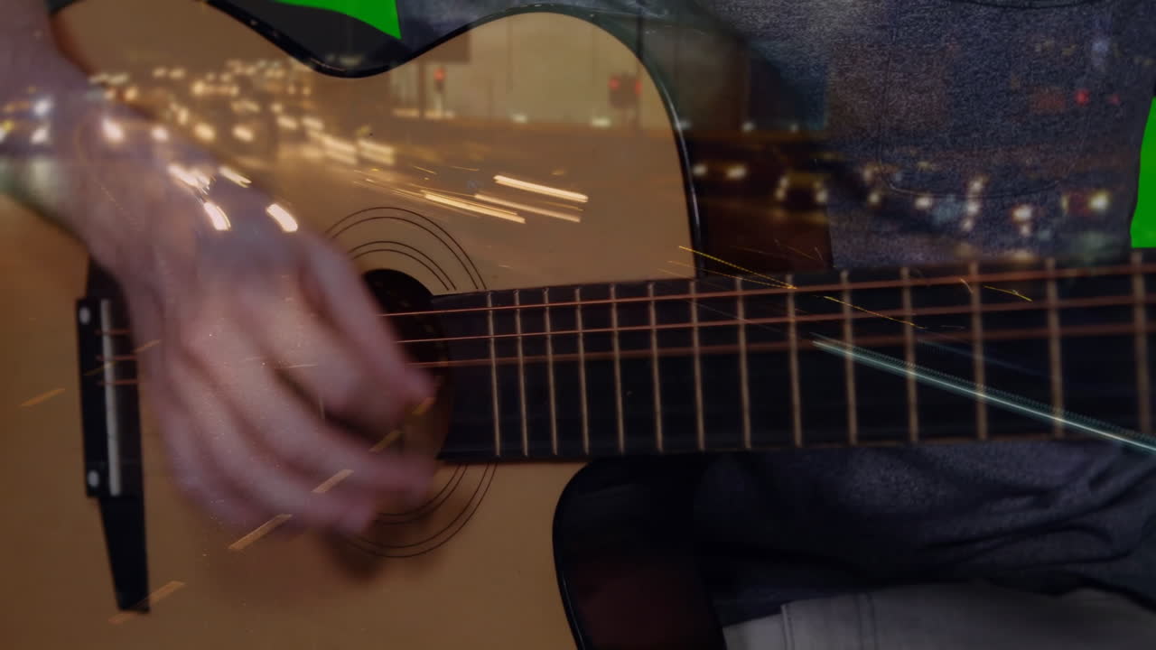 Hands pressing acoustic guitar strings while creating double exposure with warm light streaks