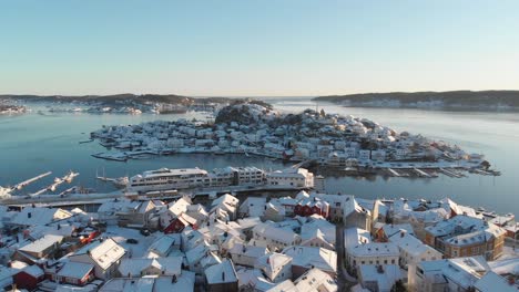 oya island from snowy community of kragerø on a sunny winter day in norway