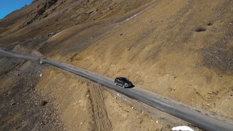 jeep off road car driving in kaza in spiti valley in himalays small narrowed dangerous indian road exploring asia travelling concept