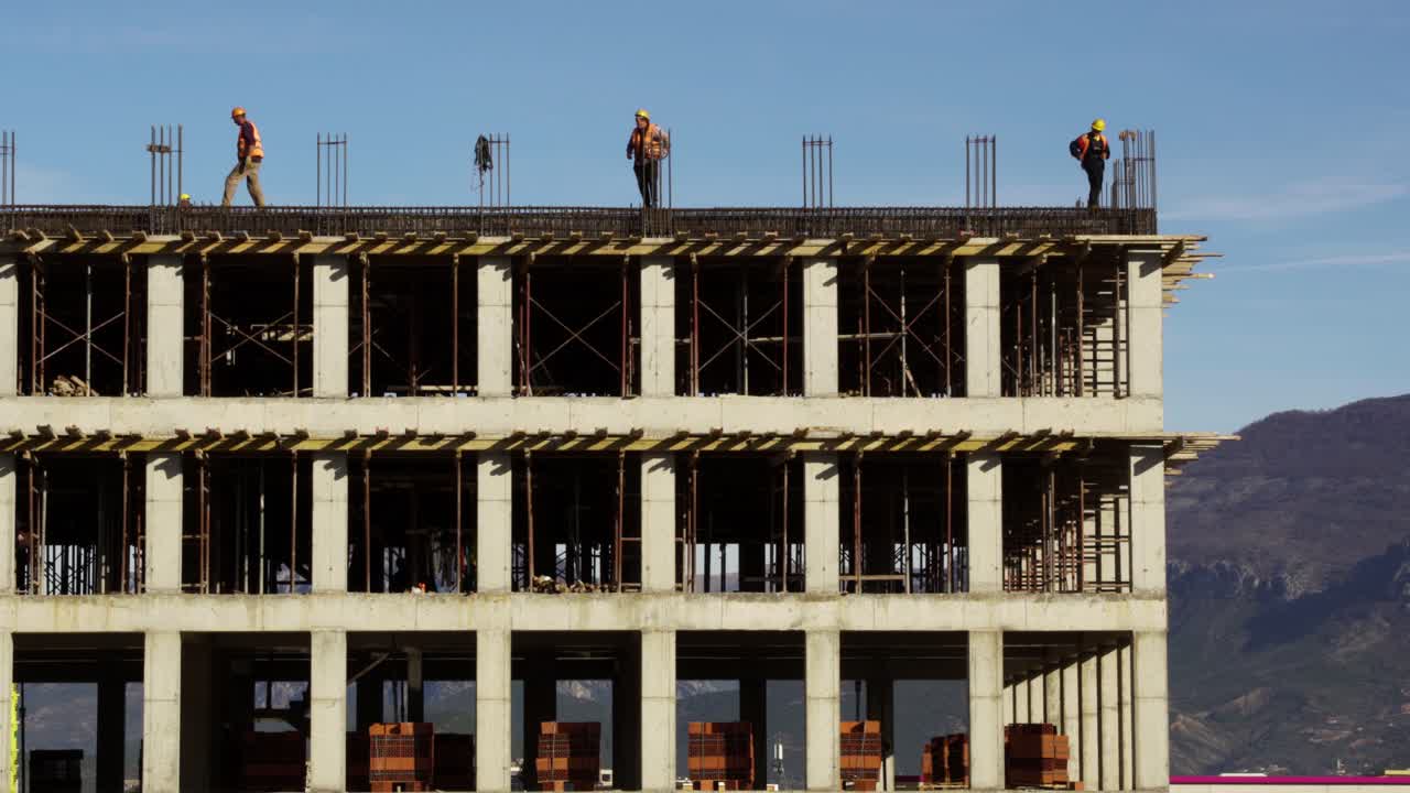 Construction Workers on a High-Rise Building