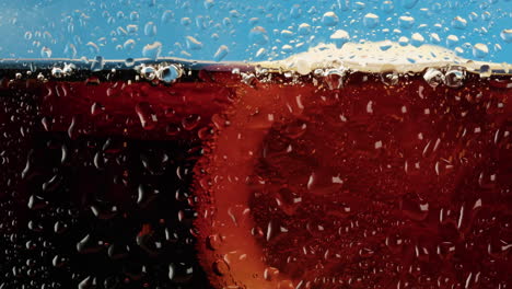 Close-up of a Soda Drink with Water Drops and Bubbles