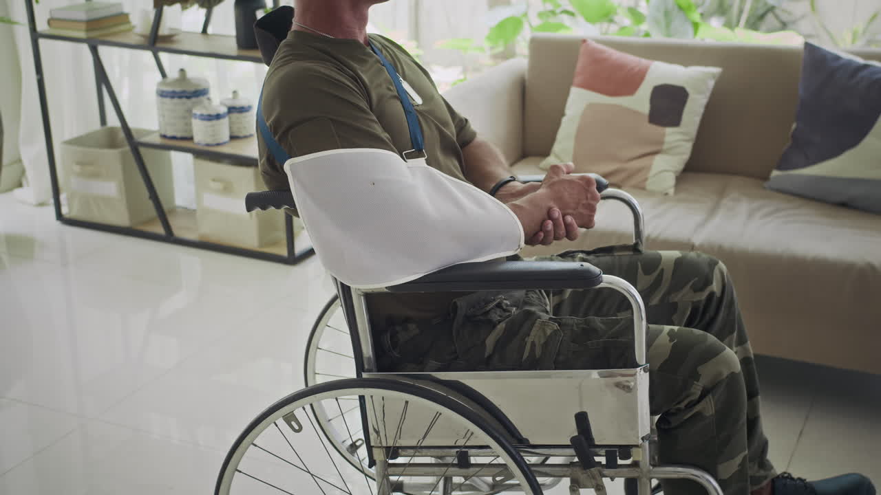 Veteran with Broken Arm in Wheelchair Recovering at Home