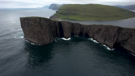 island in middle of stormy sea